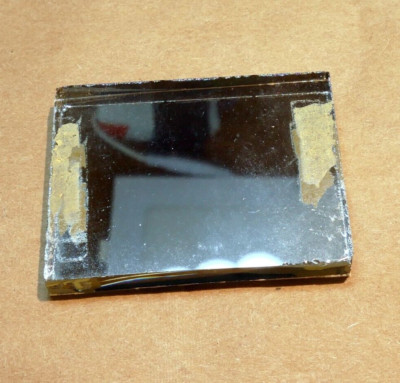 1.5X2'' Diameter 0.25'' thick First Surface 50% Semi-Transparent Mirror