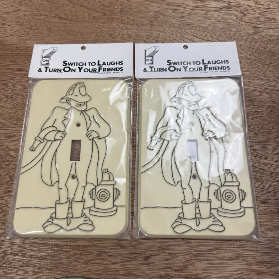 A sealed, vintage novelty light switch cover that reveals a firefighter 'flashing' when the switch is flipped — deadpan adult humor baked into everyday hardware.