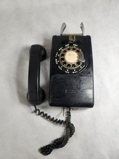 This is a vintage black rotary dial wall telephone, likely a Model 554B. AS IS