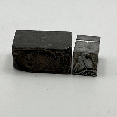 Two Metal Printing Blocks Pointing Finger Leaf On Vine