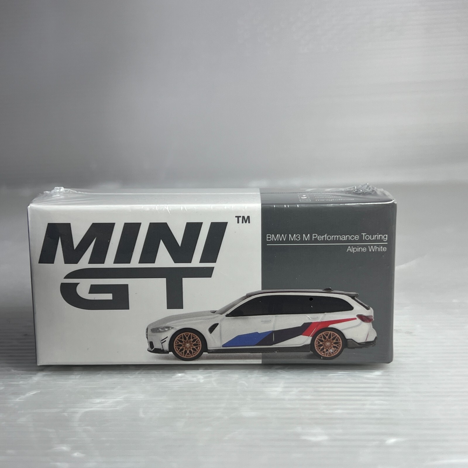 1/64 TSM MINI-GT BMW M3 M Performance Touring Alpine White RHD MGT00776-R
