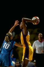 Lisa Leslie Los Angeles Sparks looks to pass the ball over Tricia - Old Photo