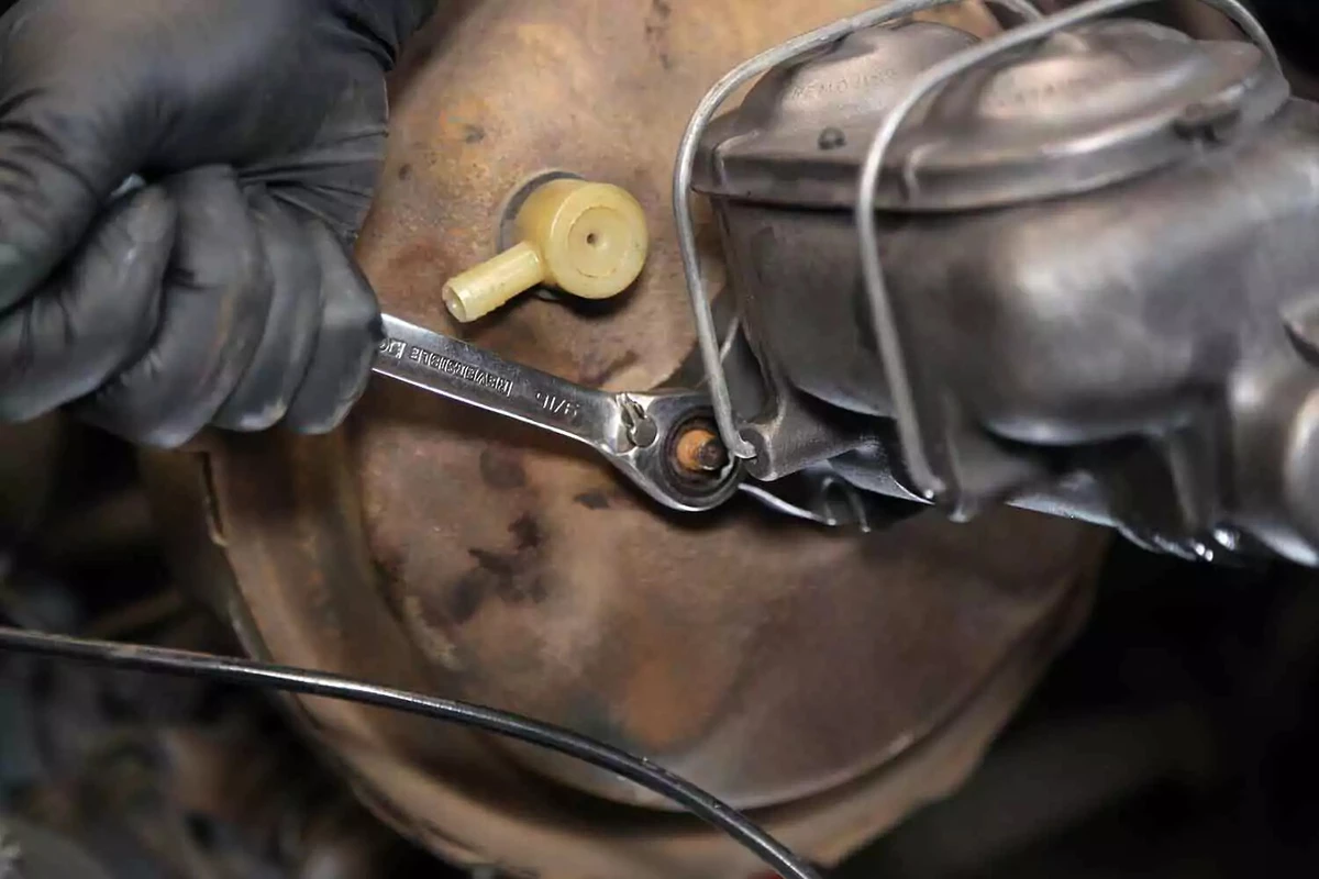 Tightening the fasteners of the brake master cylinder.