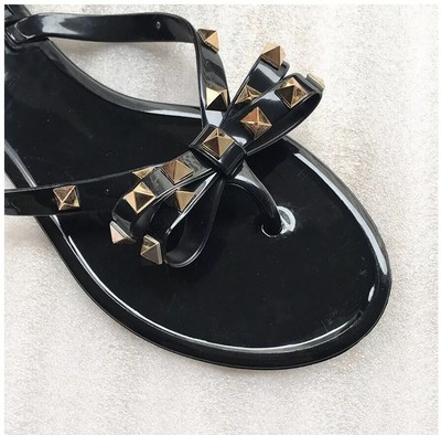 black jelly sandals with bow