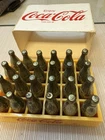 Vintage Miniature Yellow Coke Case With 24 Gold Metal Bottles.