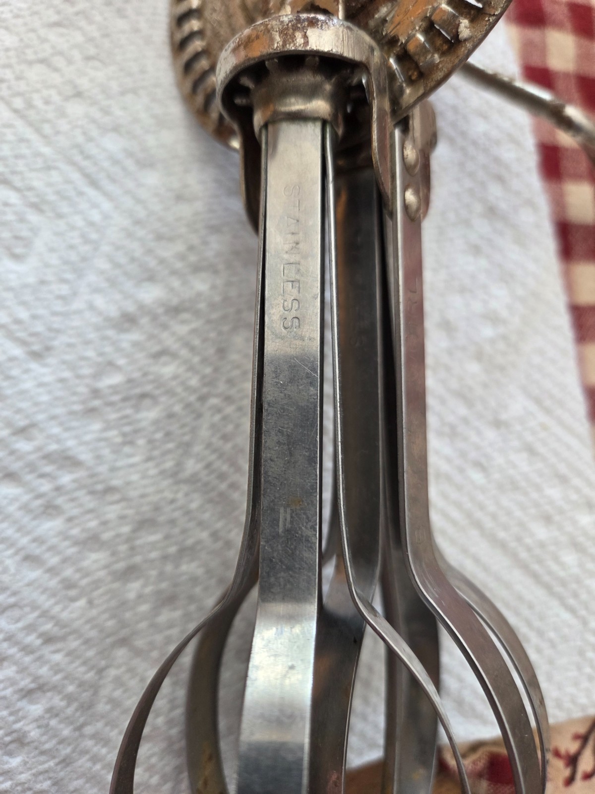 Vintage blue swirl stainless hand beater in good working condition