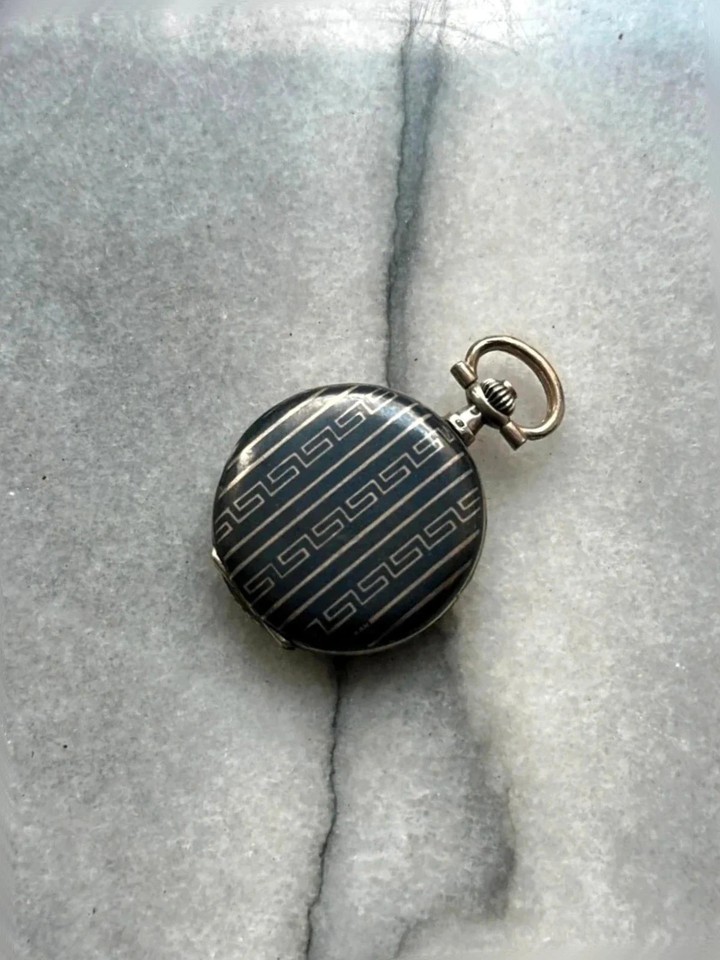 A genuine nielloed silver col pocket watch that won a Grand Prix at the 1910 Brussels World Exhibition — wearable history with a provenance story.