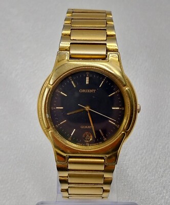 Orient Armbanduhr mit Datumanzeige, Goldfarbene. Quarz Uhr