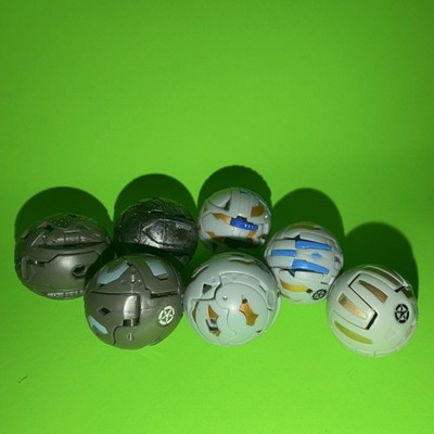 Random lot of 7 gray bakugan
