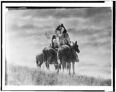Cheyenne warriors,braves,horseback,Indians,travel,clothing,dress,feathers,c1905