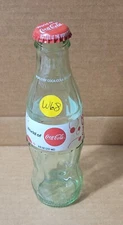 Coca Cola, Empty Bottle. 8 fl oz, 2009 World of Coca Cola, with Cap - W68