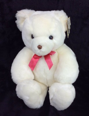 white teddy bear with red bow