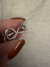Dazzling Sterling Silver Diamond Infinity Necklace