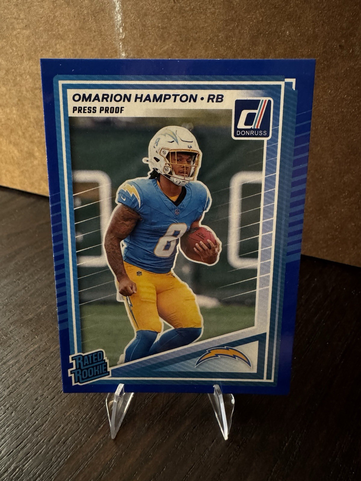 2025 Panini Donruss - Rated Rookie Omarion Hampton #303 Press Proof Blue (RC)