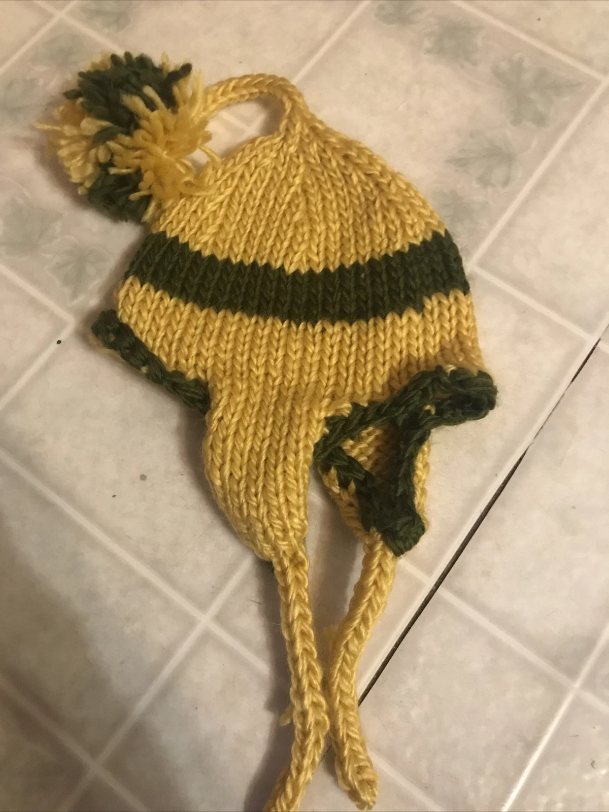 Child Ear Flap Hat Green & Gold Pom Pom Medium Weight six months - 2 years Size
Opens in a new windo