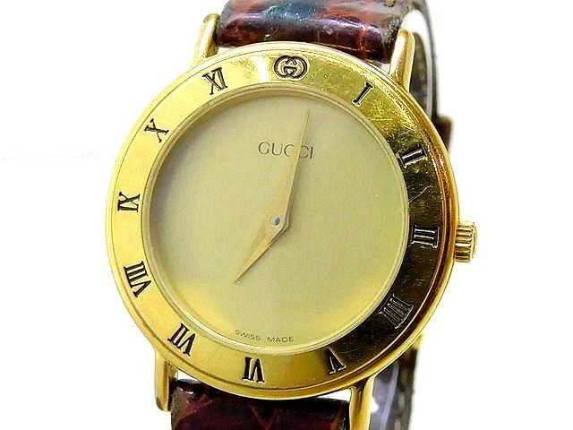 Montre femme Gucci 3000,2,L ceinture marron doré quartz ancien GUCCI 5L