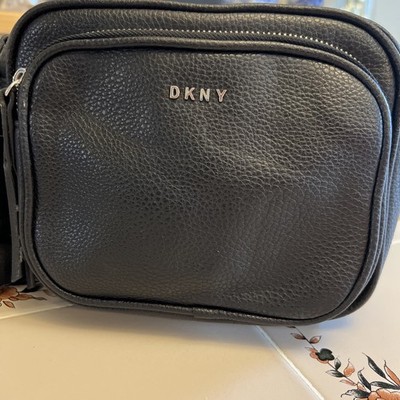 Black bag by DKNY. Made of faux leather. In perfect condition.
