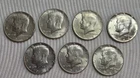 Lot Of 7 40% Silver Kennedy Half Dollars. 6 AU, 1 BU. 1.04 OzT Of Silver. A0794