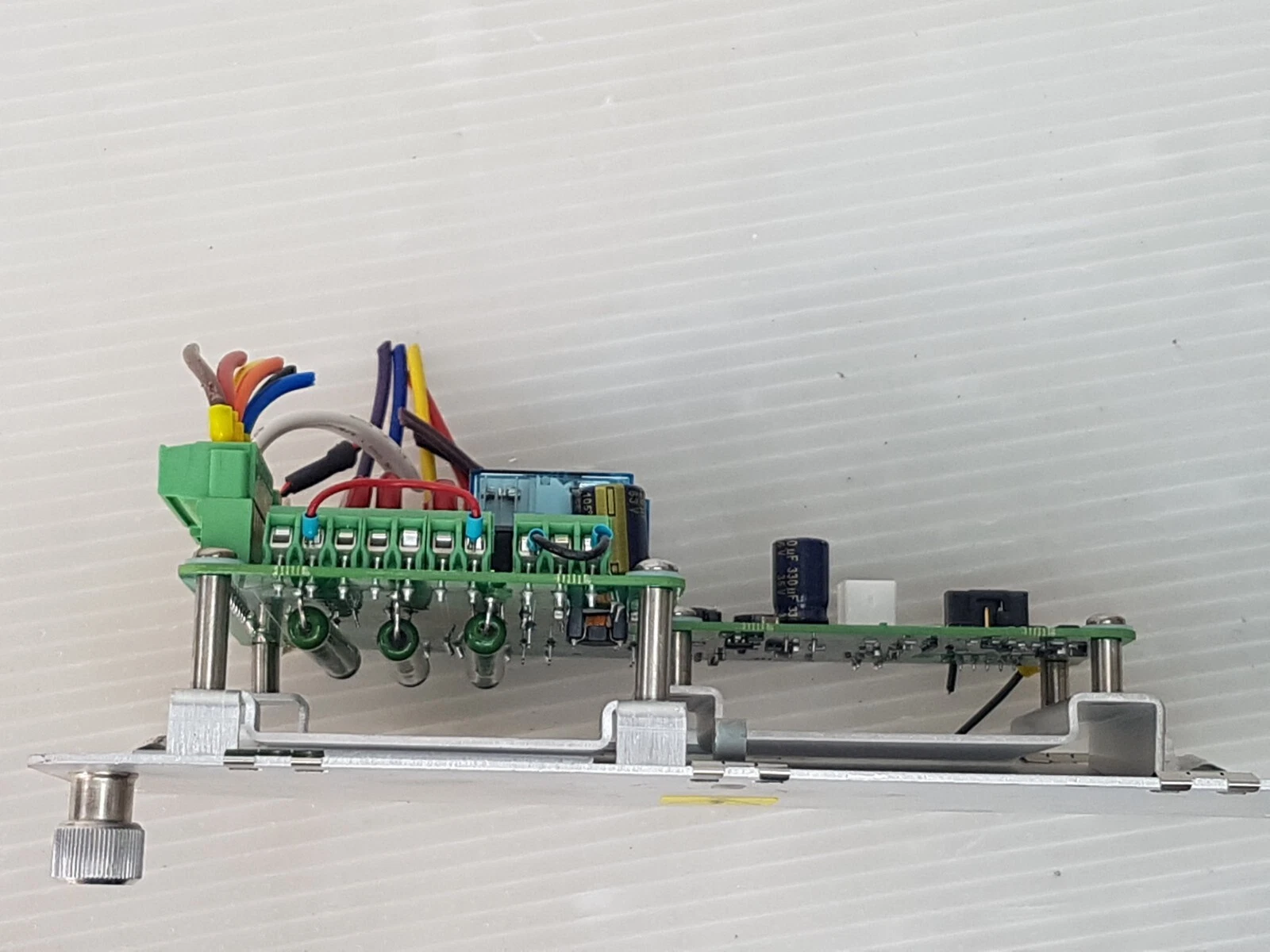 Side view of the LM-EA-10077840-B showing the board standoffs above the aluminium plate