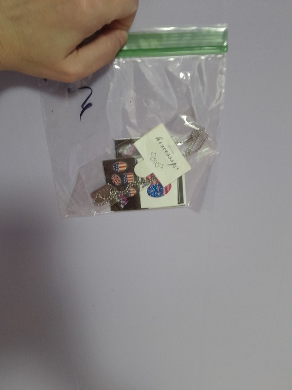 4th Of July Bag That Has A Necklace And Tattoos In It