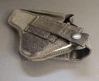 Black nylon IWB holster with double stitching, belt loop, and silver snap closure on a gray background.