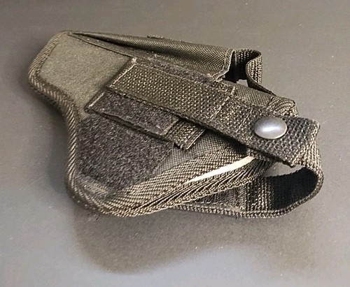 Black nylon IWB holster with double stitching, belt loop, and silver snap closure on a gray background.