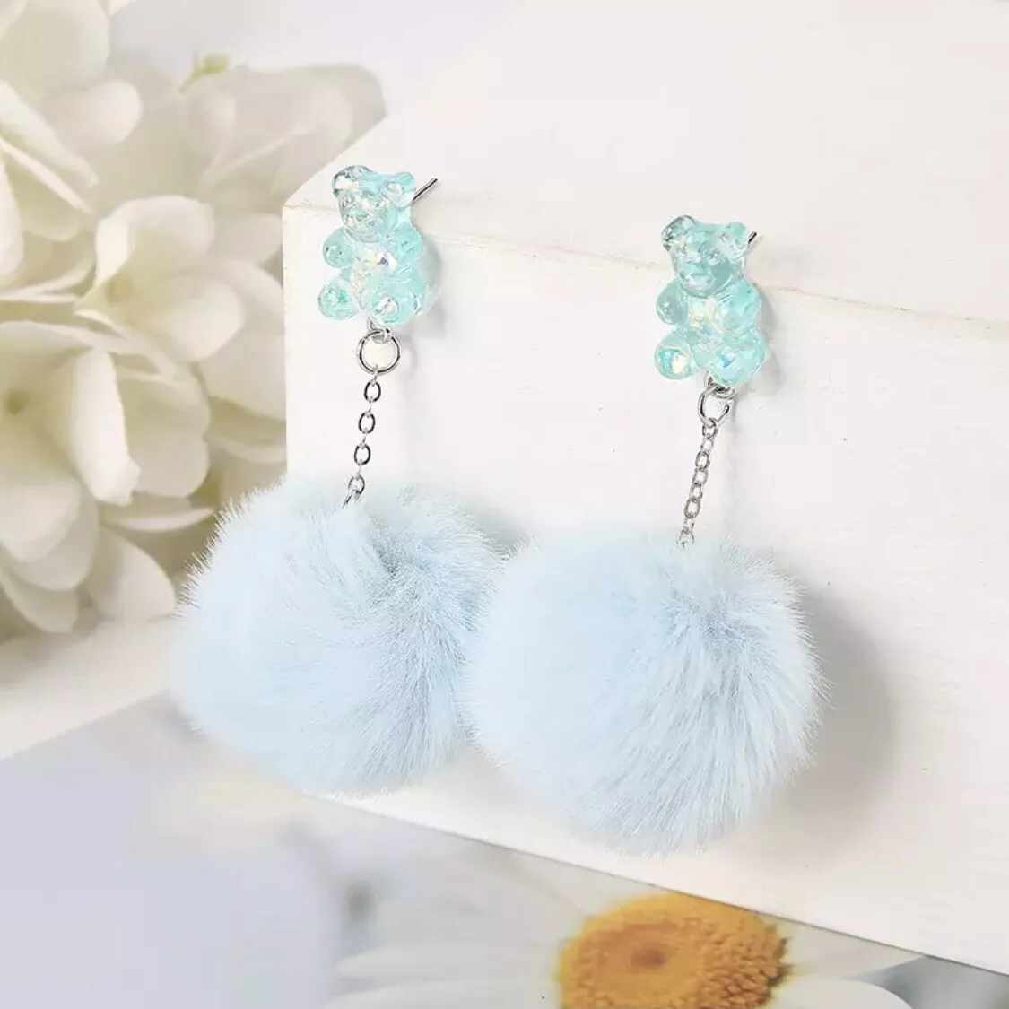 Blue pom pom earrings outlet