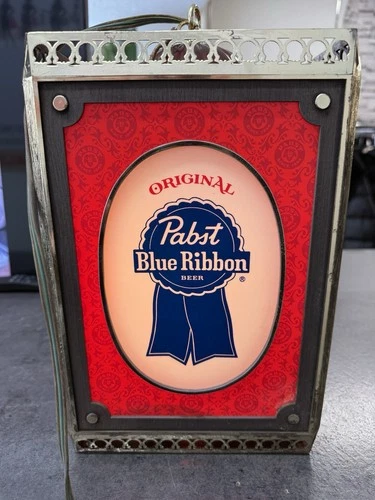 Vintage illuminated Pabst Blue Ribbon beer advertising sign.