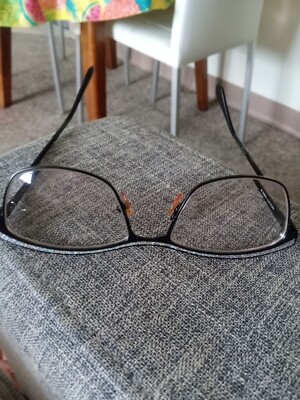 Nat and Coco Woman's Glasses. Black frame with multicolor sparkle on top. 
