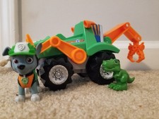 Paw Patrol, Dino Rescue Rocky  s Deluxe Rev Up Vehicle  With Action Figure