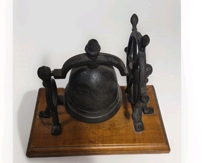 Vintage Cast Iron bell nautical ship wheel  on a wooden Board