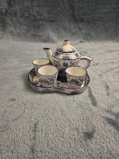 miniature blue and white ceramic tea set featuring an Oriental pattern
