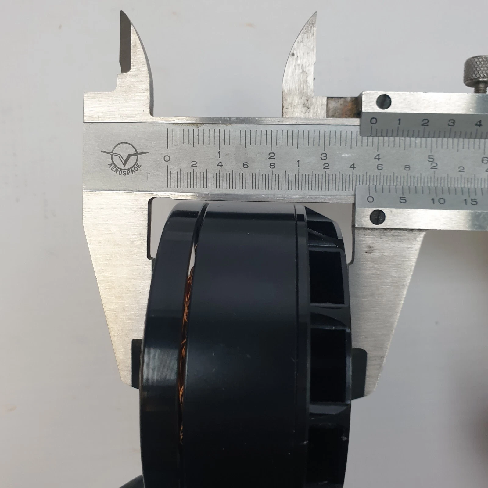 Caliper measuring the height of a KV170 motor