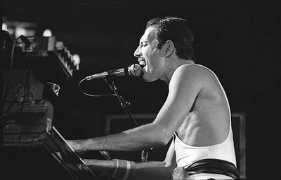 Freddie Mercury singer member of the band Queen during a concert a- Old Photo 39