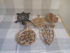 5 vintage cast iron trivets good condition