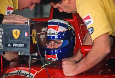 Alain Prost #27 of the Ferrari team works with team engineers duri- Old Photo 1