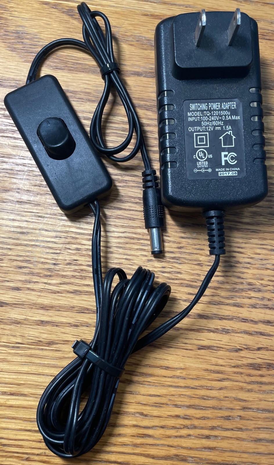 12V 1.5A Switching Power Adapter Model: TQ-1201500u Input: 100-240V~ 0.5A Max