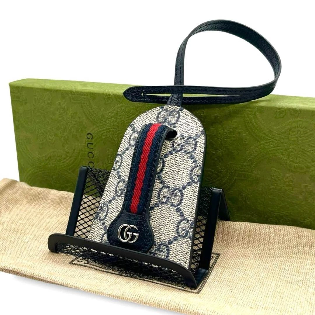 Étui à clés GUCCI GG Supreme PVC et cuir bleu marine et ivoire avec boite d'origine bu7