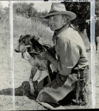 1963 Press Photo Actor Brian Keith & dog star in 