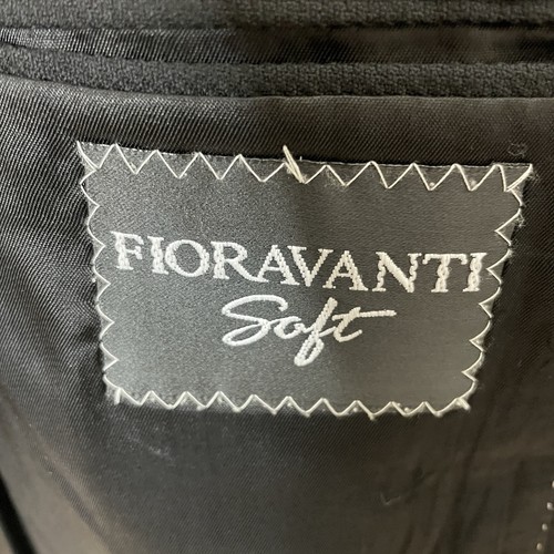 White Fiorvanti Soft blazer jacket with notch lapels, three-button front closure, and diagonal white label on inner collar.