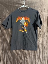 Halloween Graphic T-shirt featuring a skeleton with a flaming pumpkin. Kids XL