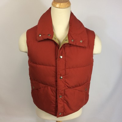 orange sleeveless puffer jacket