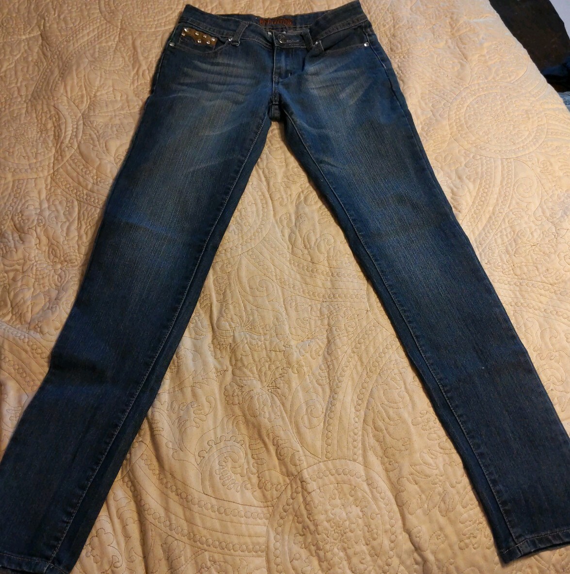 Free Culture skinny medium wash jeans with rhinestone emblishments