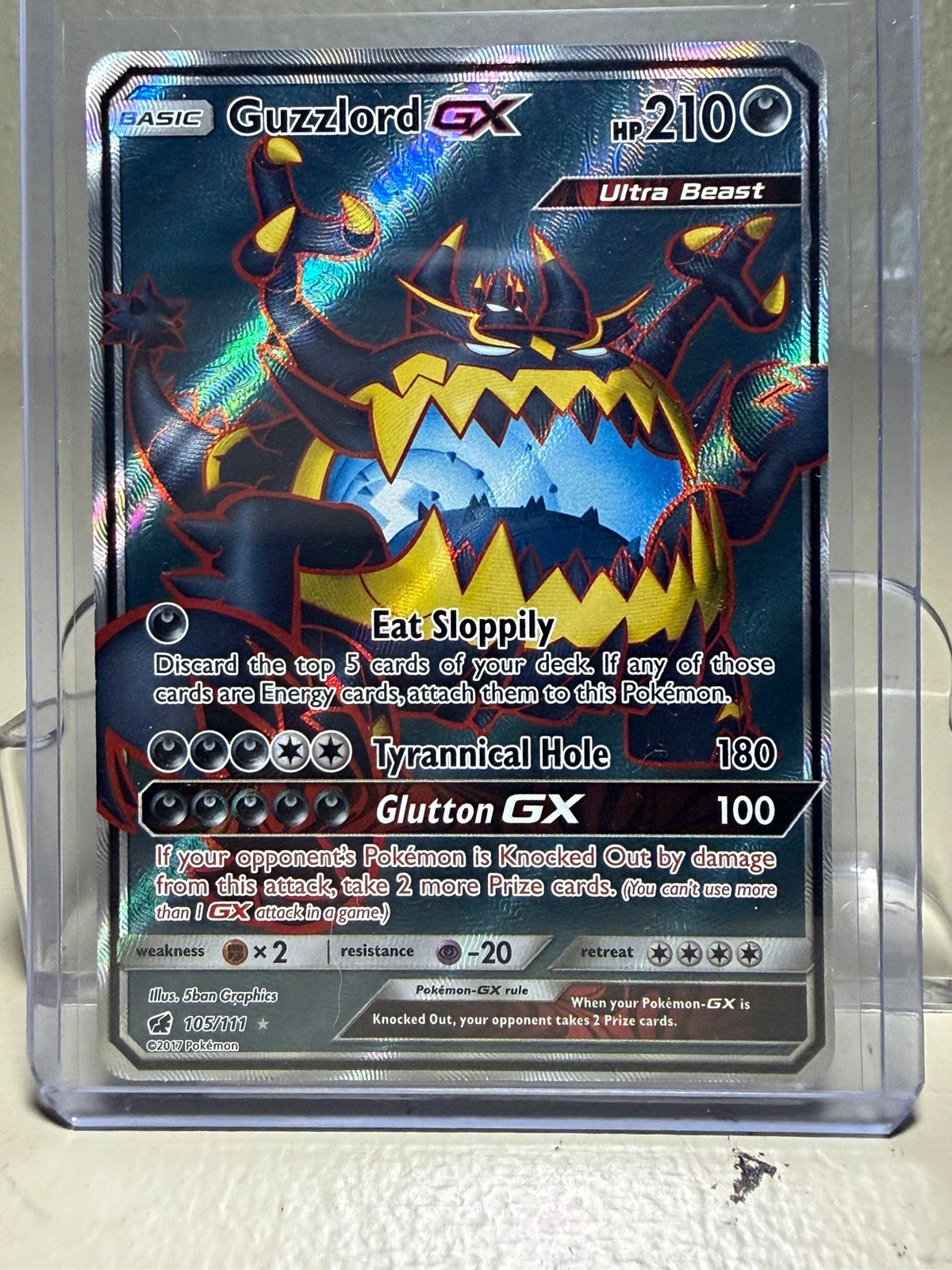 The Pokémon Company Guzzlord GX 105/111 Crimson Invasion Full Art Holo UR