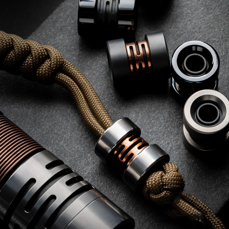 Titanium Alloy Folding Knife with Lanyard Bead Umbrella Rope Key Tool Pendant for Versatile Use