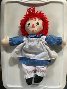 red haired doll with a triangle nose