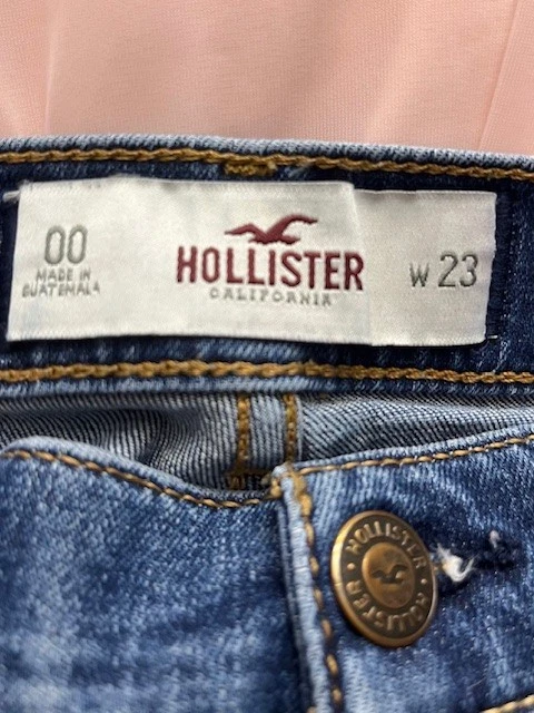 Mini micro pantalones cortos de mezclilla Hollister lavado medio Y2k tiro bajo dobladillo con puños talla 00/23 Foto 3 de 4
