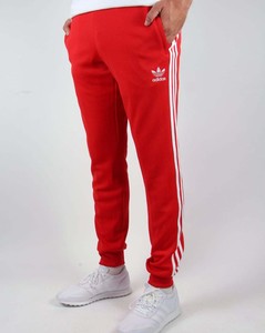 red adidas cuffed track pants