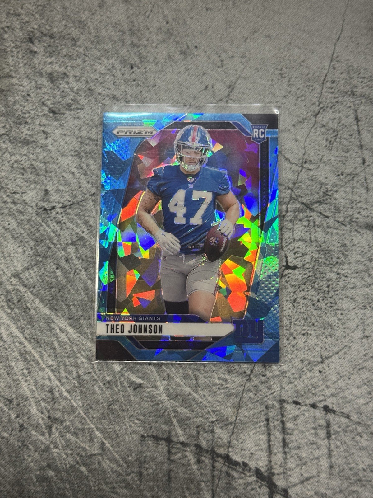 2024 Panini Prizm Rookies Theo Johnson #390 Blue Ice Prizm /99 Team Color Match