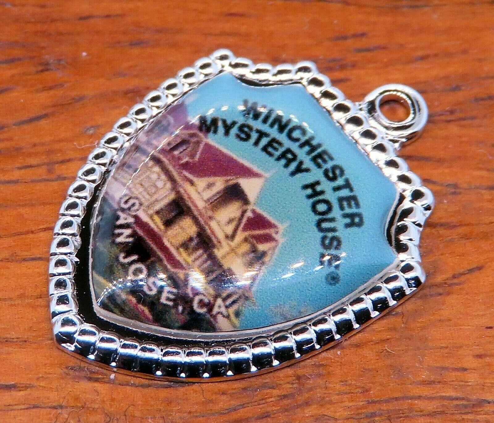 Vintage silver WINCHESTER MYSTERY HOUSE SAN JOSE CALIFORNIA SHIELD charm 33-14